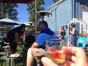 Sharing tasters in the beer garden at Port Townsend brewing