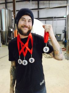 Goodlife's Tennessee Jed, hoists medals from the Best of Craft Beer Awards. Photo shamelessly pinched from Goodlife's Facebook page.