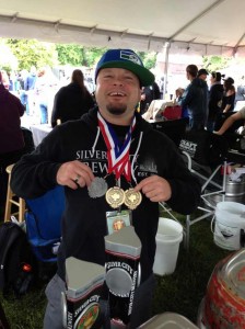 Kurt Larson shows off Silver City Brewing's medals. 