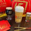 Glasses of beer and Chinese red envelopes announce the Lunar New Year celebration.