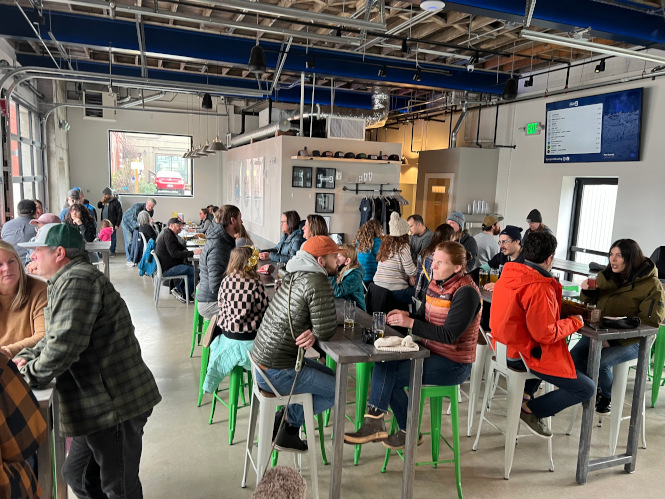 A crowded taproom at Project 9 Brewing.