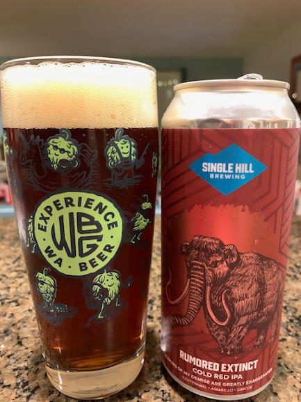 A Washington Beer pint glass full of beer from Single Hill Brewing.