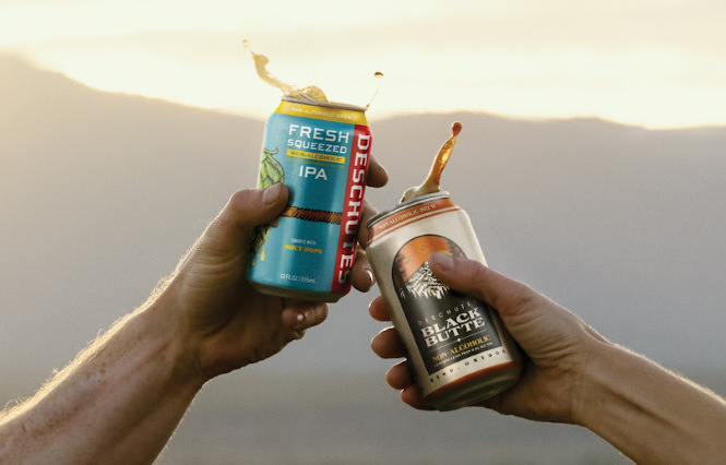 Two cans of non-alcoholic beer from Deschutes Brewery.