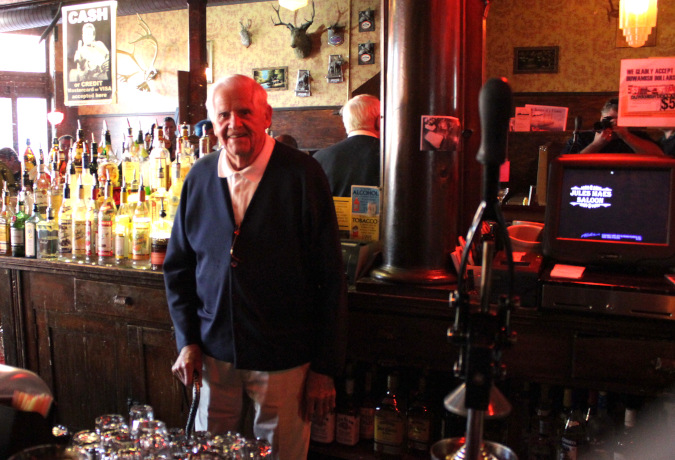 Walter Maes behind the bar at Jules Maes Saloon.