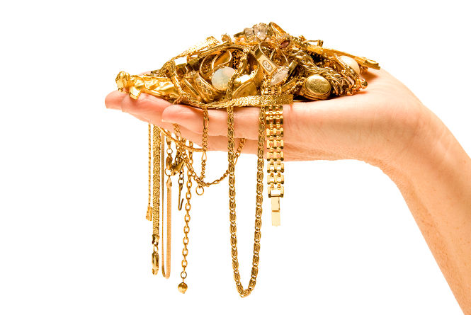 A handful of gold jewelry, health benefits of wearing gold.