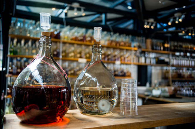 Bottles of liquor on a bar, part of Seattle's culinary scene.