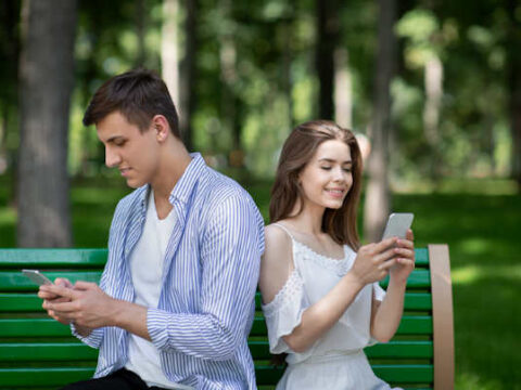 couple on their phones during a date.