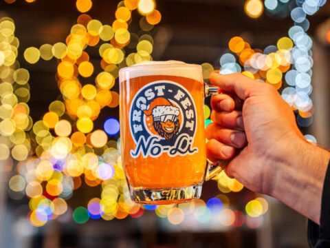 A mug of beer branded with No-Li Frost Fest.