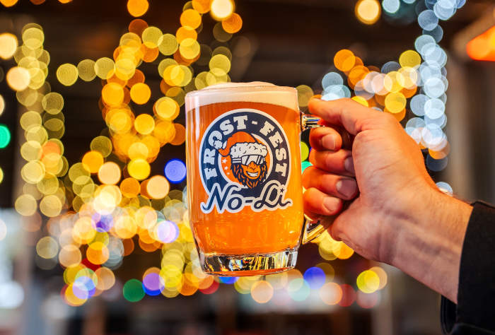 A mug of beer branded with No-Li Frost Fest.