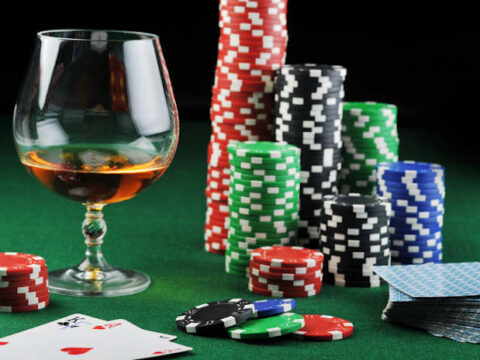 Craft beer and interactive gaming, a beer on a table with cards and poker chips.