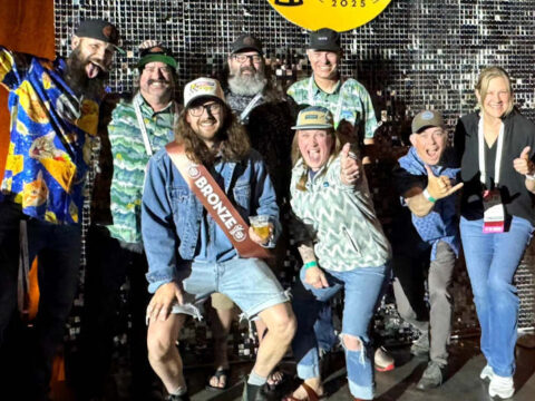 A group of people celebrate a win at the World Beer Cup
