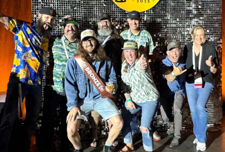 A group of people celebrate a win at the World Beer Cup