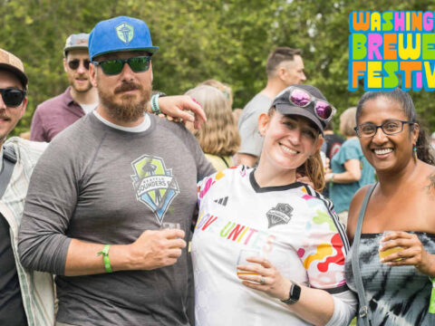 Four friends enjoying a beer festival