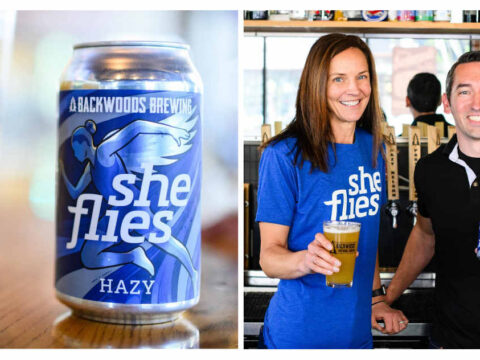 A can of beer next to a picture of a man and a woman holding glasses of beer