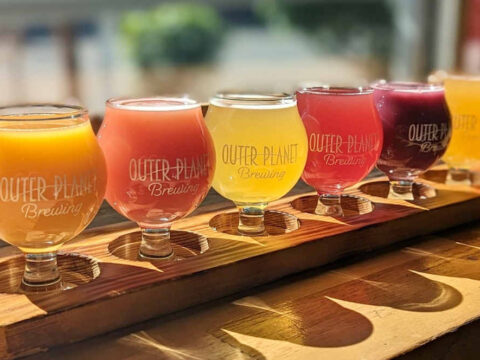 Outer Planet Brewing Announces It’s Found New Ownership A colorful flight of beers at Outer Planet Brewing