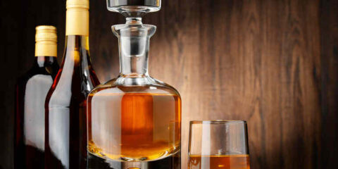 Elegant Irish single malt whiskey served in a crystal decanter with a tasting glass.