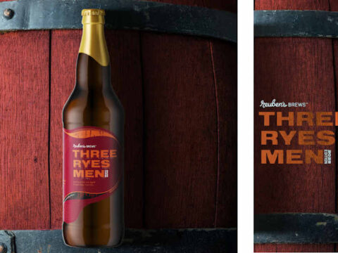 Reuben’s Brews Releases Three Ryes Men on Saturday, Nov. 1st A bottle of beer with a barrel in the background