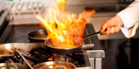 Beer and Cocktails: Washington Breweries Just Got More Options A flaming frying pan on a stove in a restaurant