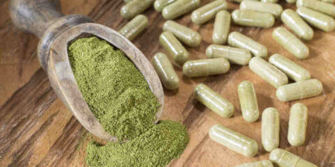 Kratom powder and capsules display.