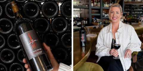 Kristin Bacon sits with a glass of the wine named for her