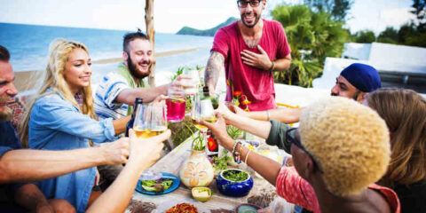 Friends hanging out at the beach party.