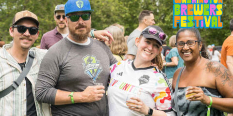 Four people enjoying a beer festival