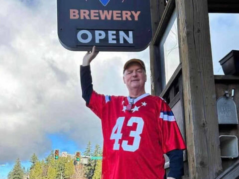 Skagit River Brewery Sold – The Owner Announces Retirement A man in a football jersey in front of a brewpub