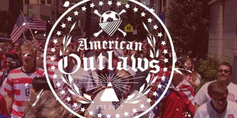 Reuben’s Brews and The American Outlaws Present an Epic Match Day A crowd of USA soccer supporters marching to a match
