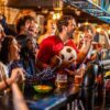 Friends cheering while watching a 2026 World Cup match at a bar with pints of beer, capturing the excitement of choosing the best bookmaker for game day.