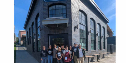 The New Version of Boundary Bay Brewery Reopens Today in Bellingham A group of people standing in front of a new brewery and pub.