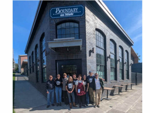 The New Version of Boundary Bay Brewery Reopens Today in Bellingham A group of people standing in front of a new brewery and pub.