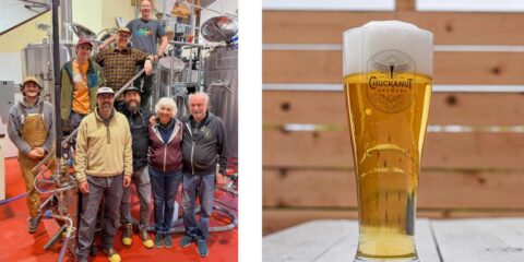 Volatility West Coast Pils, a Collaborative Riff on a Beloved IPA A group of brewers in a brewery, standing on the brew deck
