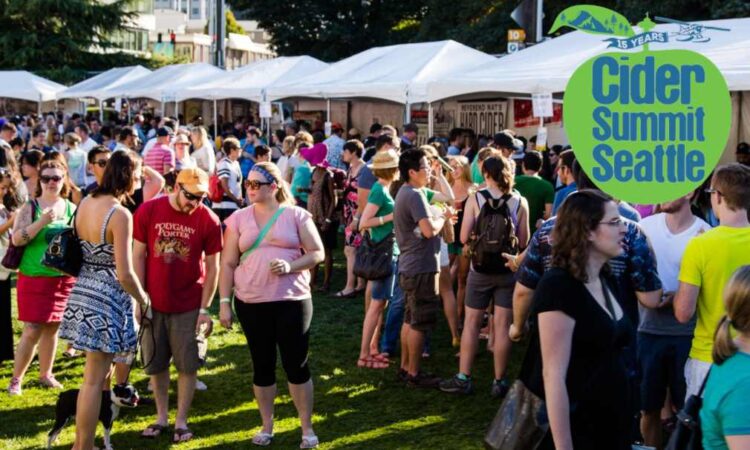 A crowd enjoying a cider festival on a sunny day