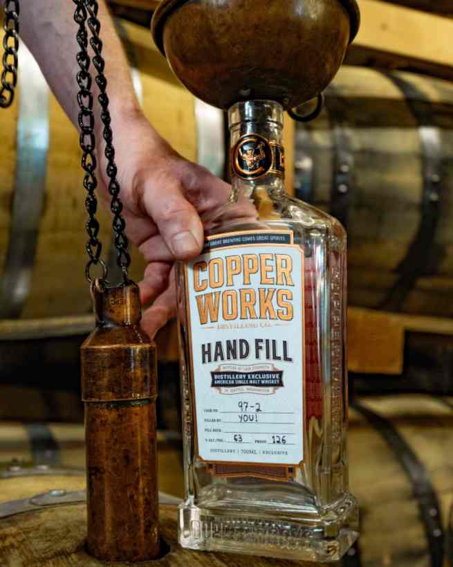 A hand-filled, personalized bottle of Copperworks whiskey