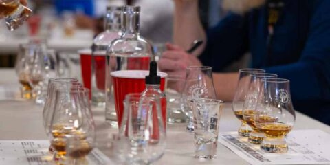 Fun, Entertaining, Educational, Delicious Series of Summer Events at Copperworks glasses of whiskey on a table at a whiskey-blending workshop