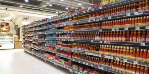 How a West Coast Farmers Market Brand Reached International Shelves Supermarket shelves stocked with packaged food products, illustrating the retail expansion of a West Coast farmers market brand into nationwide and international stores.