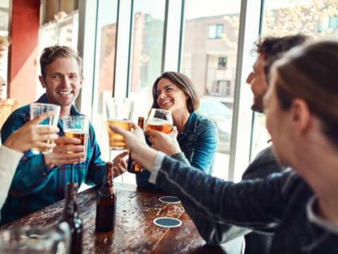 Can Your Friendship Group Influence Your Drinking Habits? Friends enjoying drinks together at a pub, highlighting how social circles can influence drinking habits and shared behaviors.