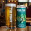 Just in Time for the Trade Deadline, Single Hill Makes a Roster Move A can of beer sitting next to a freshly poured pint