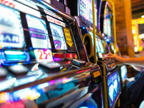 Colorful slot machines in a casino are capturing attention with bright screens and immersive game displays.