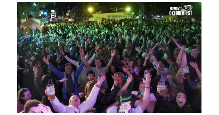 We’ve Got a Ticket Code For You – Oktoberfest Returns to Fremont A crowd of people whooping it up at a beer festival