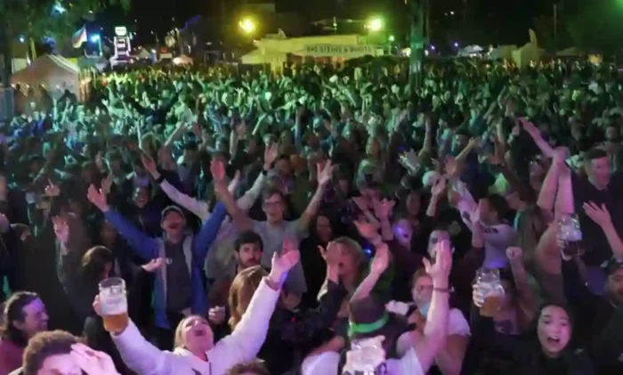 A large crowd of people at a beer festival