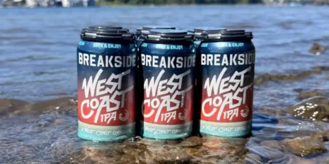 Breakside Defines West Coast IPA, and Frankly, They’ve Earned the Right To a six-pack of beer sitting in the shallows of a river