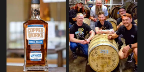 A group of people crouched around a barrel of whiskey