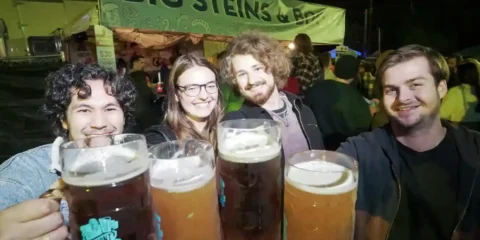 Seattle’s Largest Beer Fest Returns to the Streets of Fremont, September 18 – 20 Four people enjoying beers at a lively beer festival