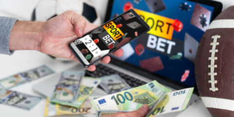 Top Sportsbook Software for Bookies: Risk Controls, Live Betting, and Provider Quality Person using sportsbook software for live sports betting with cash and sports equipment.