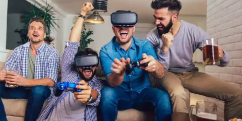 Gamers wearing VR headsets and drinking beer while playing a video game with adaptive difficulty.