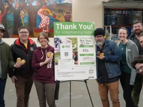 2 Towns Ciderhouse launches Hunger Action Month campaign for Oregon Food Bank A group of volunteers at a food bank