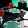 Live Dealer vs RNG Slots: Odds, Payouts, and Which One Suits You Best Live dealer casino game with poker chips, dice, playing cards, and computer keyboard representing RNG slots and casino games.
