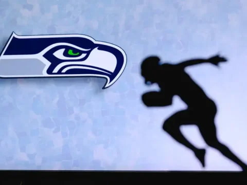 Moneyline, Spread, Totals: Seahawks Betting Terms for Beer Fans Seattle Seahawks logo alongside a silhouette of a football player running.