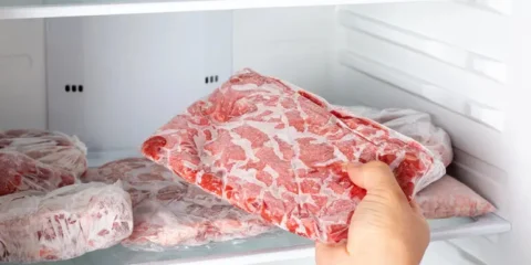 Fresh beef cuts stored in a refrigerator for proper home storage.